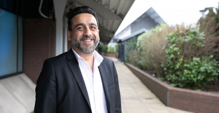 Man stood in a courtyard